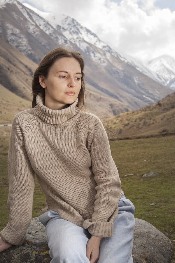 Young woman on the top in the mountains stock photography Young woman on the top in the mountains stock photography