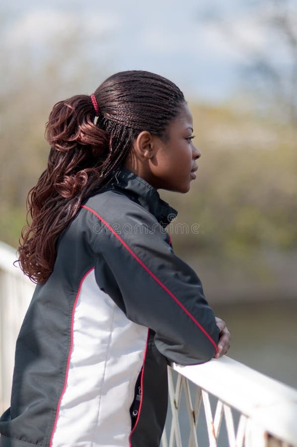 Young woman in track suit in profile royalty free stock photography Young woman in track suit in profile royalty free stock photography