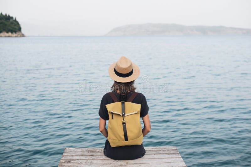 Enjoying life. Back side of young man looking at the sea, vacations  lifestyle, mindfulness, summer fun concept Stock Photo