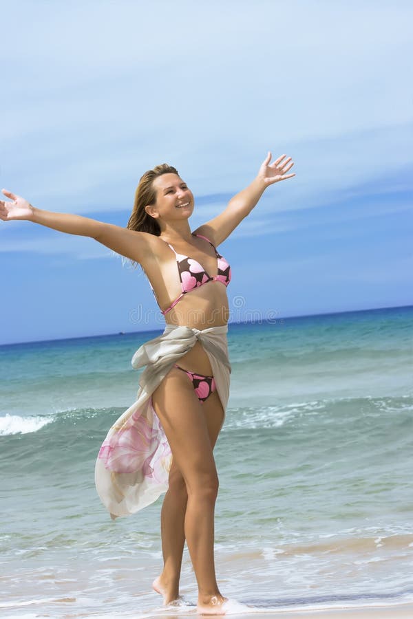 Young woman on the tropical beach stock photo