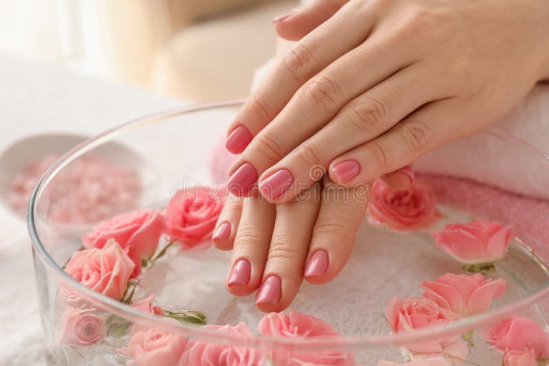 Nail care procedure in a beauty salon. Female hands and tools for manicure  on pink background. Concept spa bodycare. 8160609 Stock Photo at Vecteezy