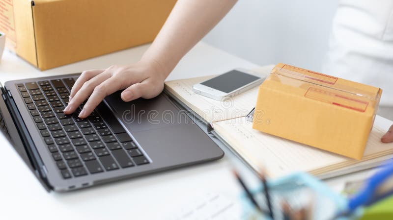 Young woman uses a laptop to chat with customers who come to order product