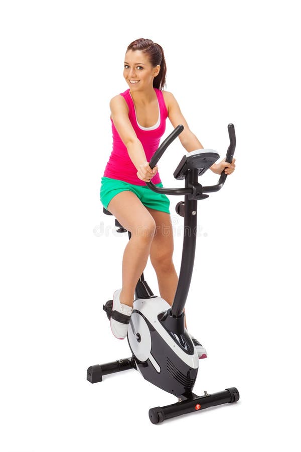 Young Woman Uses Stationary Bicycle Trainer. Stock Image Image of