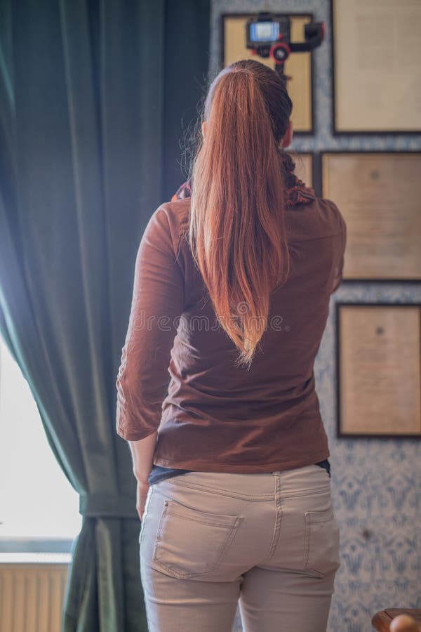 Young woman using a gimbal camera stabilizer stock photos
