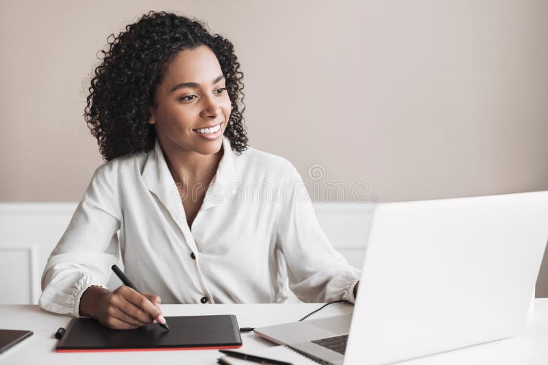 Young woman using laptop computer at office. Student girl working at home. Work or study from home, freelance, business