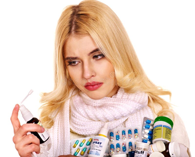 Young woman using throat spray. stock images