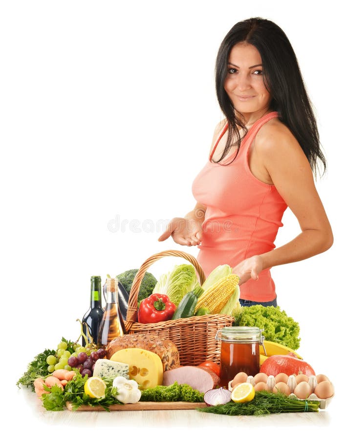 Young woman with variety of grocery products