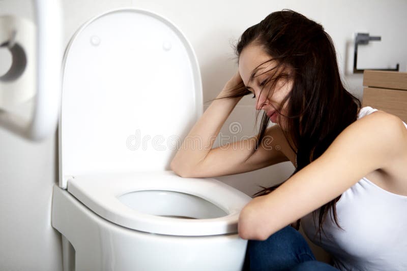 Woman Leaning On Open Toilet Seat At Indoor Bathroom Stock 