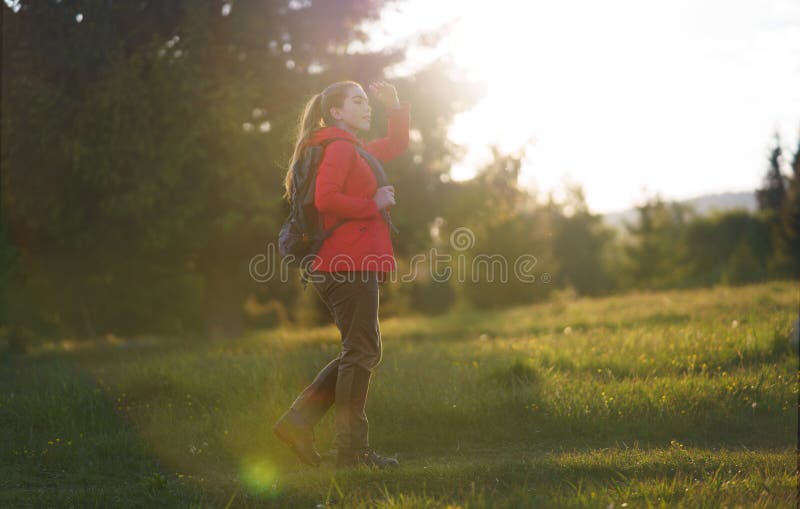 Young Woman on a Walk Outdoors on Meadow in Summer Nature, Walking ...