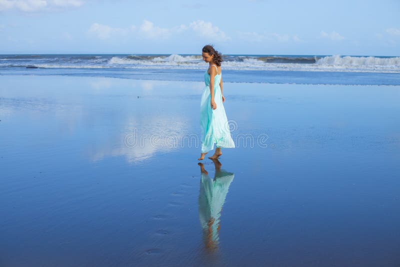 Young Woman Walking Barefoot on Empty Beach. Full Body Portrait. Slim ...