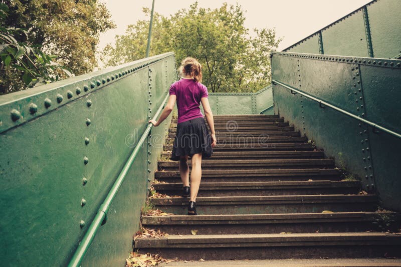Girl Walking Down Stairs High-Res Stock Photo - Getty Images