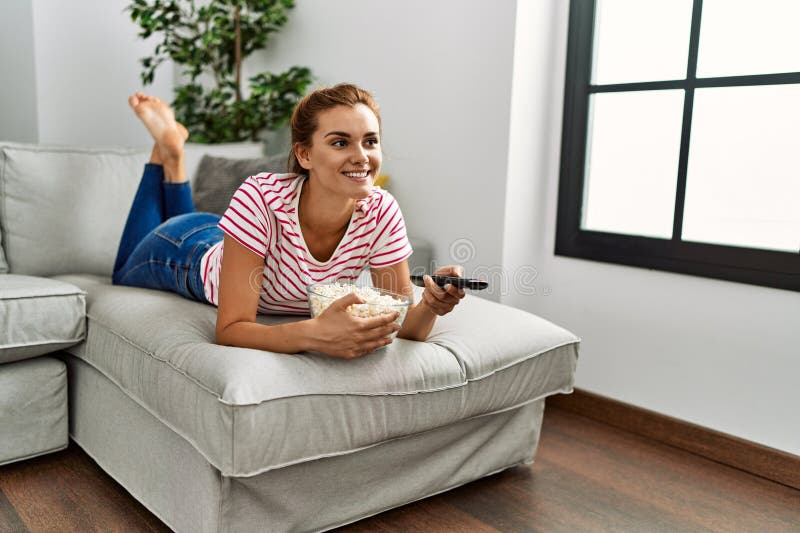 Young Woman Watching Movie Lying on Sofa at Home Stock Image Image of