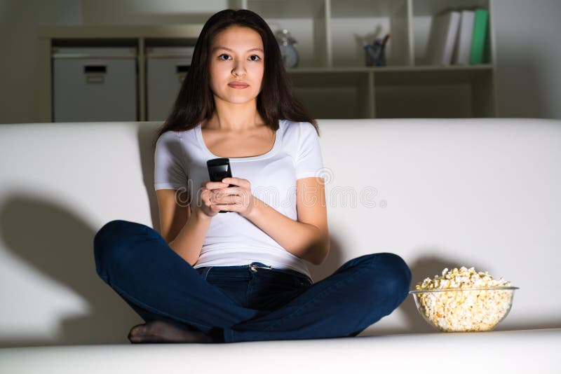 Young woman watching TV