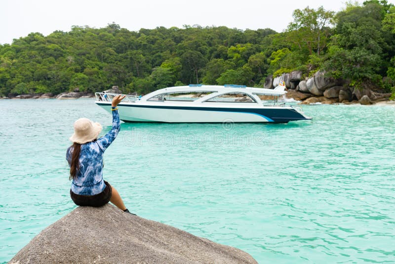 Young woman waving at yacht royalty free stock photography Young woman waving at yacht royalty free stock photography