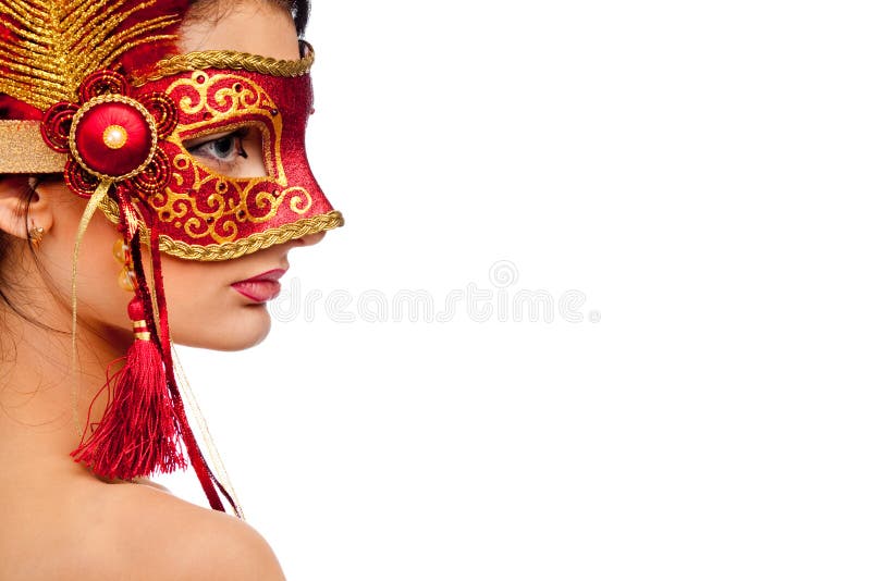 Young woman wearing carnival mask