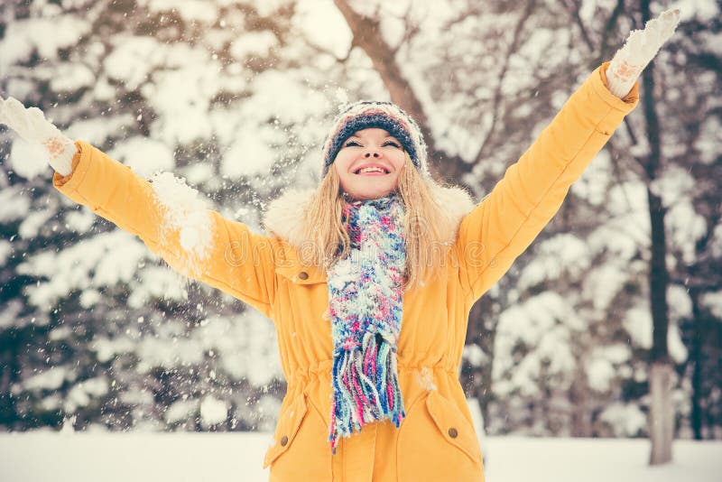 Young Woman wearing hat and scarf happy smiling