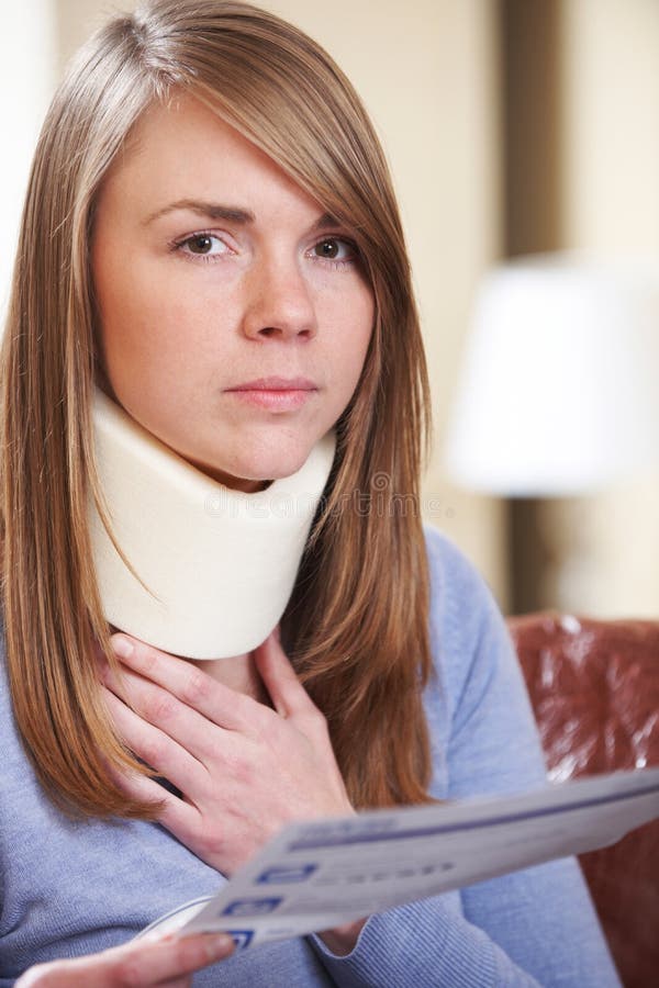 Young Woman Wearing Neck Brace Reading Letter Stock Photo - Image of ...