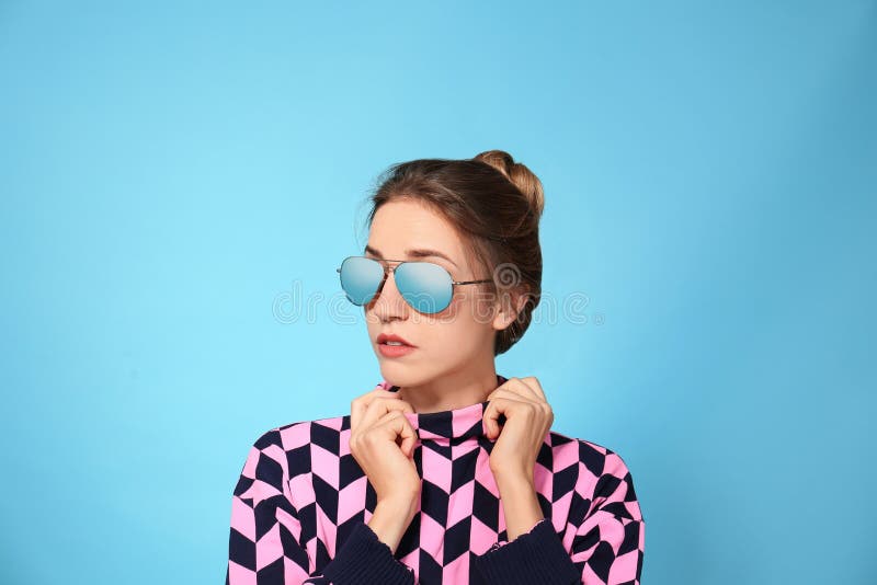 Young woman wearing stylish sunglasses