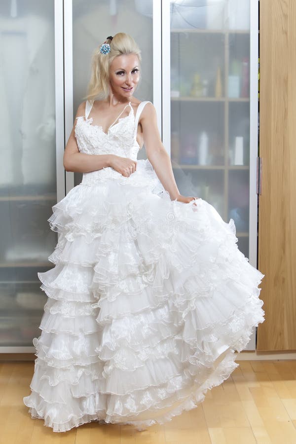 The Young Woman with a Wedding Dress in Hands Stock Image Image of
