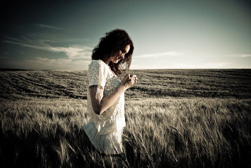 Young woman at wheat