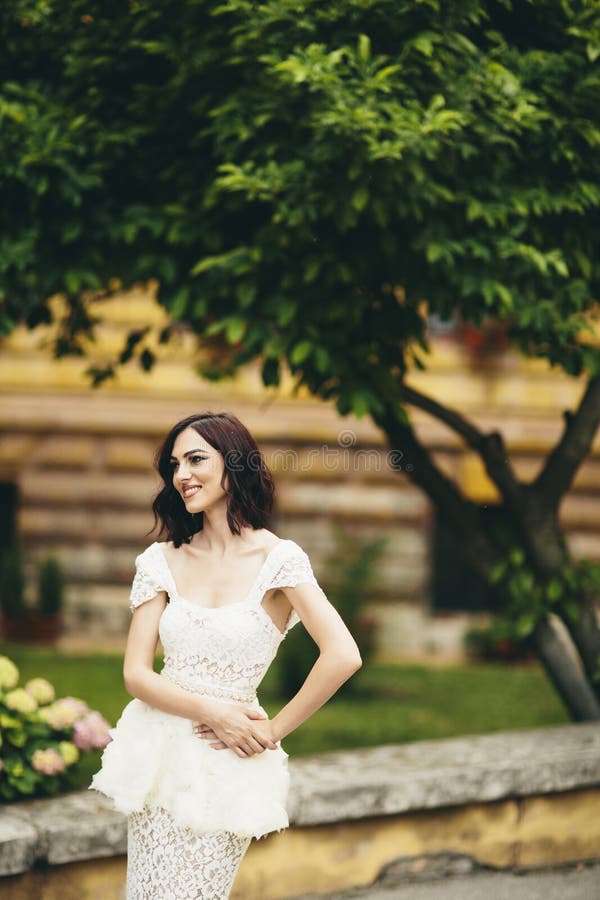 Young woman in white dress on the street stock photography Young woman in white dress on the street stock photography