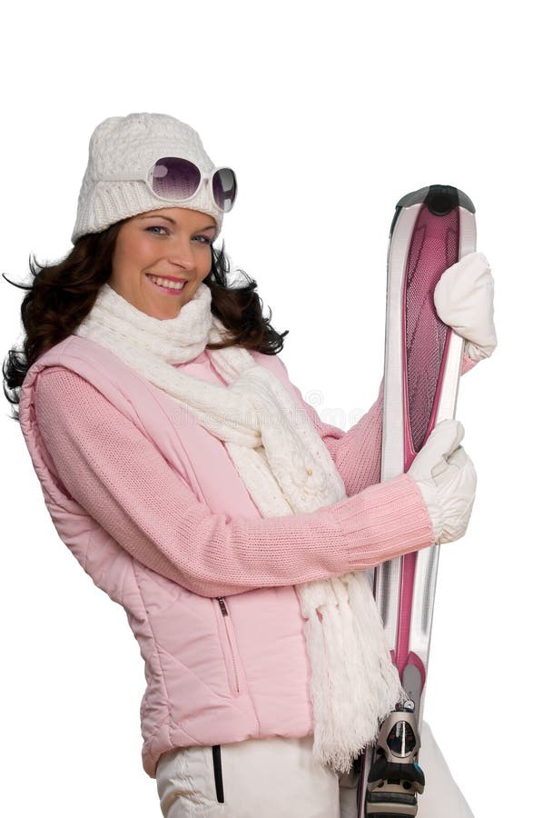 Young woman in winter fashion holding pink ski