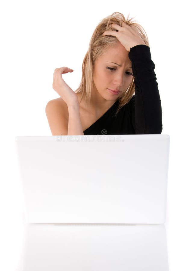 Young woman worried using a withe laptop