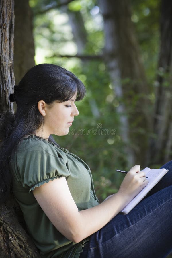 Young Woman Writing in Journal