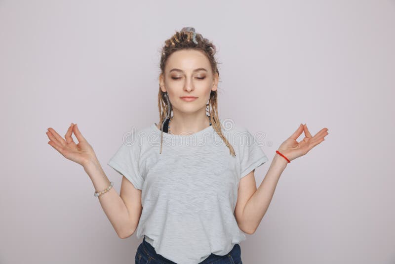 Young Woman in a Zen Pose in a Studio. Stock Photo Image of model