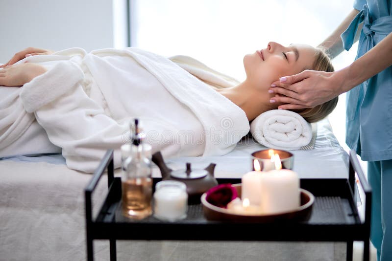 Young Woman Doing Relaxing Face Massage In Salon Classic Massage For Purpose Prevention Stock