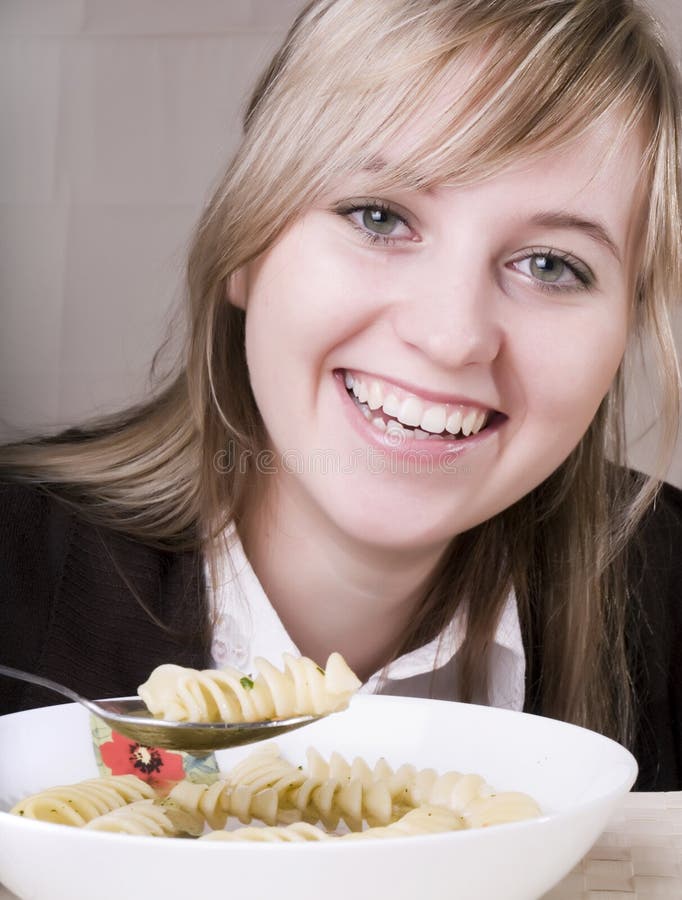 Young women eating soup royalty free stock image