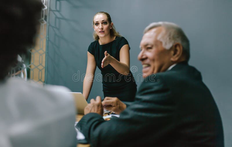 Businesswoman leading a meeting in office royalty free stock photo Businesswoman leading a meeting in office royalty free stock photo