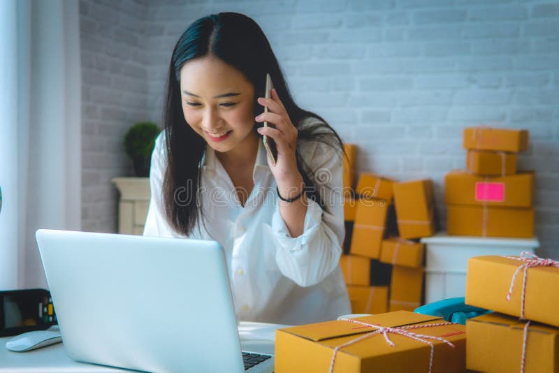 Young Women happy after new order from customer, business owner stock image Young Women happy after new order from customer, business owner stock image
