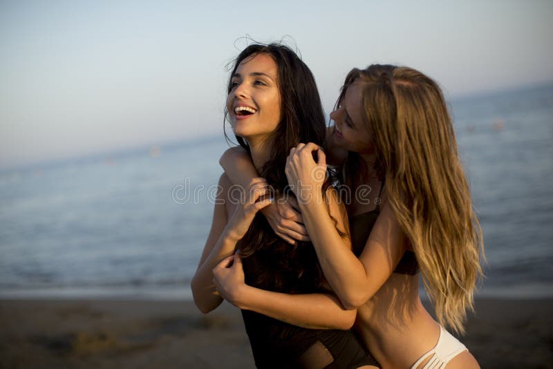 Young women having fun on the beach