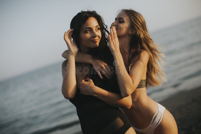 Young women having fun on the beach