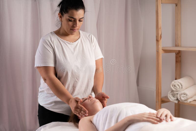 Young Woman Having Massage In Spa Salon Manual Sculpting Facial Buccal Massage Rejuvenating