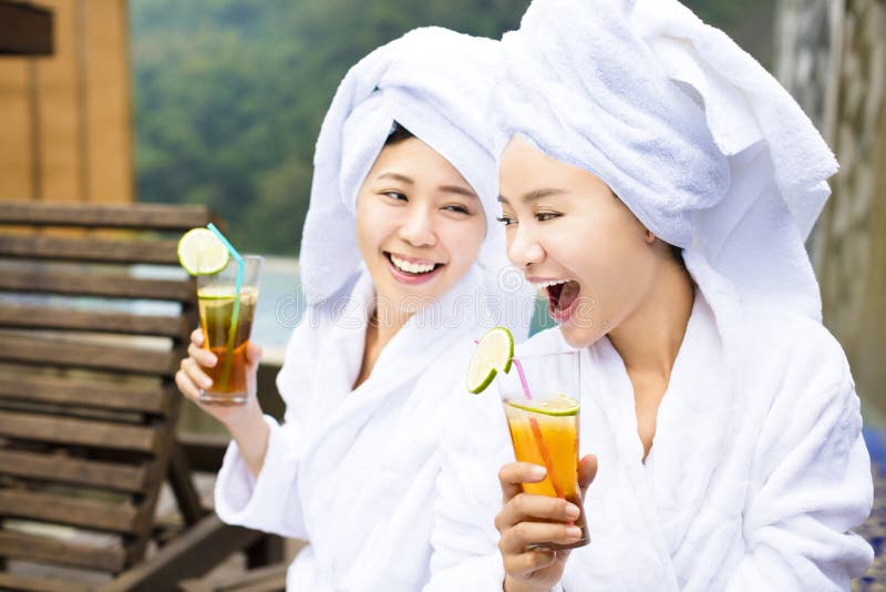 Young Women relaxing and drinking tea after spa royalty free stock photo Young Women relaxing and drinking tea after spa royalty free stock photo