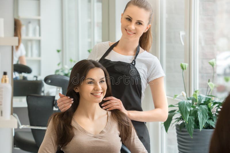 Young women sitting in beauty hair salon style