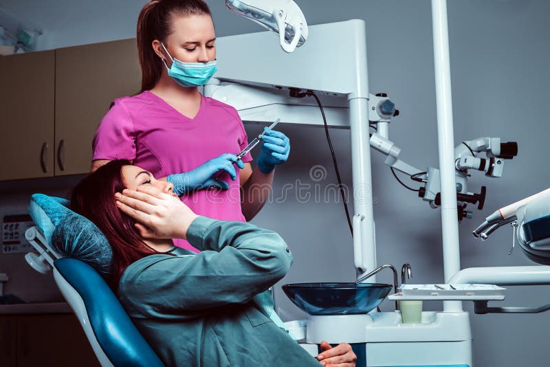 A Hot Redhead Dentist Woman Taking Care Of Her Patient Stock Image Image Of Office Seat