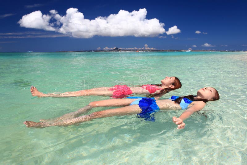[Image: young-women-swimming-beach-picture-beaut...698546.jpg]