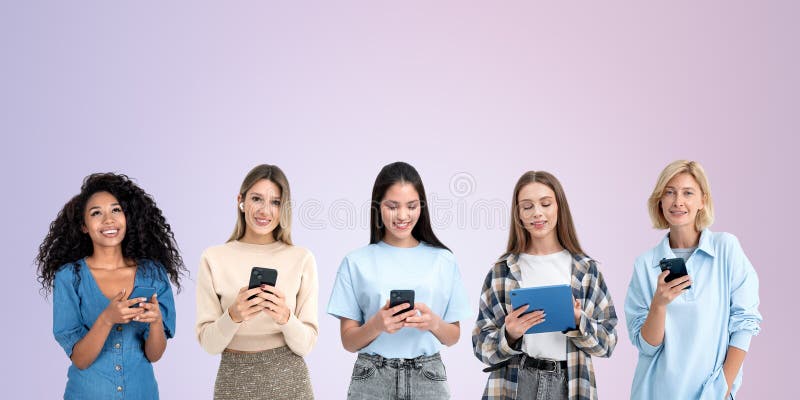 Young women teamwork with devices in hands on copy space background stock photography