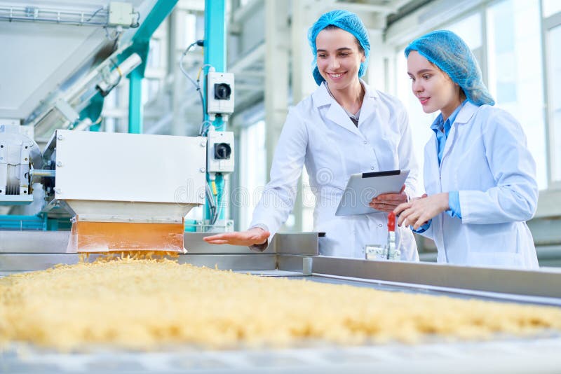 Young Women Working at Food Factory