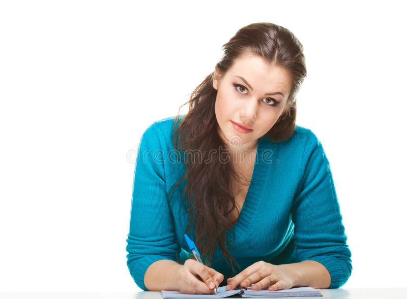 Young women writing in the exercise book