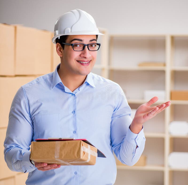Young Worker in the Postal Office Dealing with Parcels Stock Image