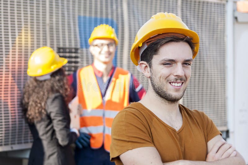 Young Workers in a Junkyard Stock Image Image of engineer, caucasian