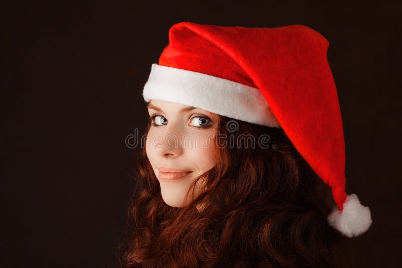 Young girl in santa claus hat