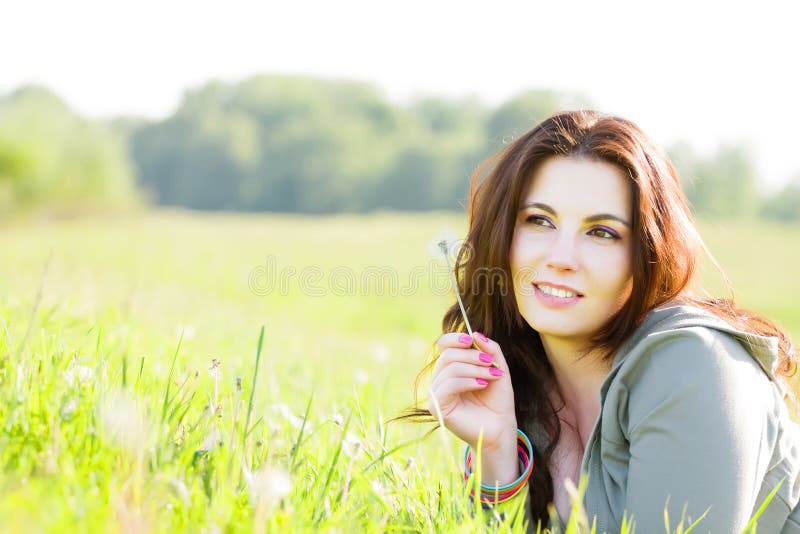 Young girl relaxing in grass