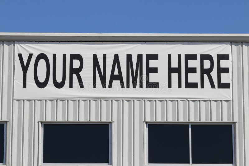 Your Name Here banner on the exterior of a vacant building for lease or rent I