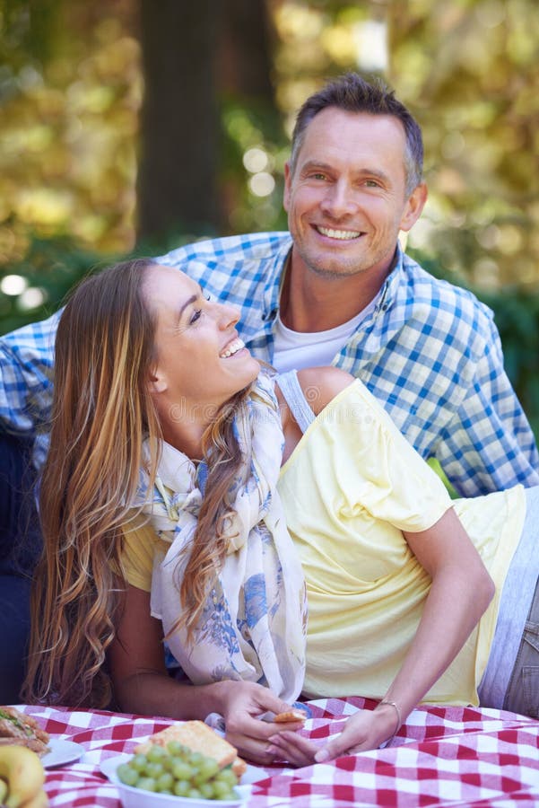 Youre So Romantic A Mature Couple Portrait Of A Married Couple Enjoying A Picnic Outdoors 