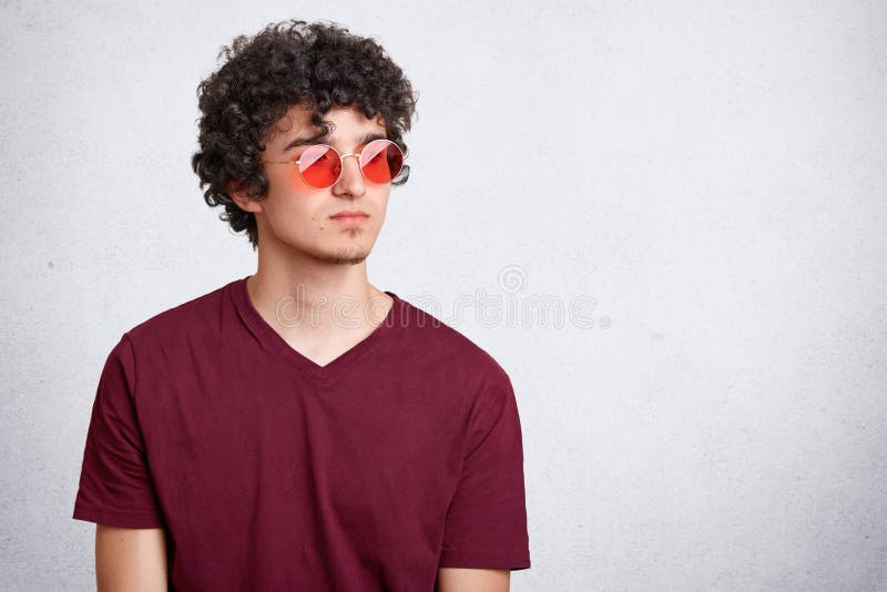 Youth, Style and Fashion Concept. Attractive Male Teenager with Crisp Dark Bushy  Hair, Wears Trendy Red Sunglasses and Casual T Sh Stock Photo - Image of  hair, male: 116532894